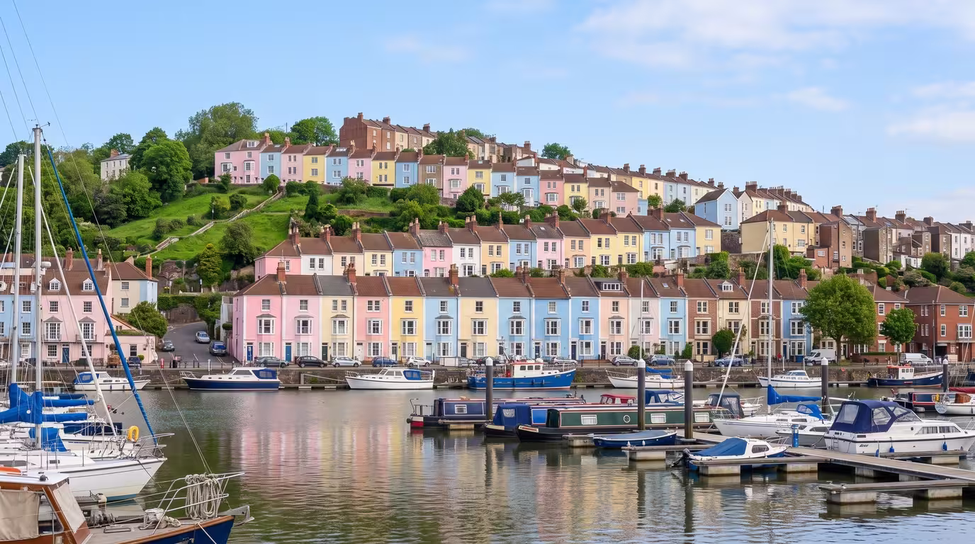 Colourful terraced houses on a Bristol hillside above the harbourside in daylight